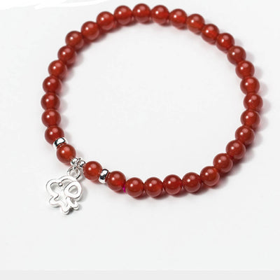 Bracelet en pierre agate rouge avec charm en argent